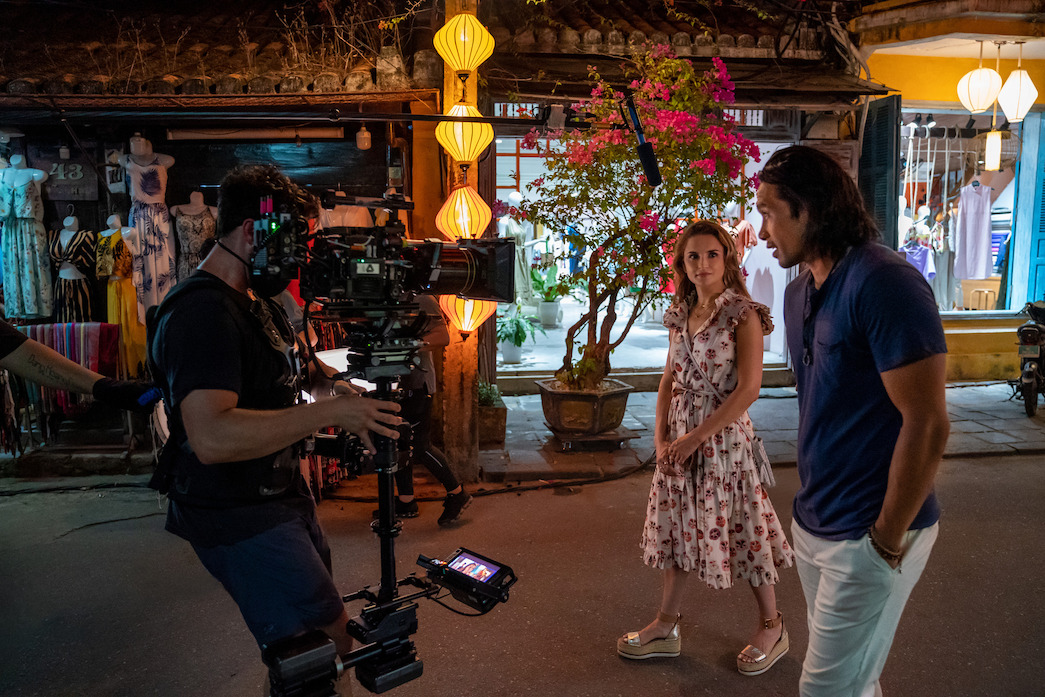 Rachael Leigh Cook and Scott Ly, as Amanda and Sinh, stroll the streets of Hoi An.