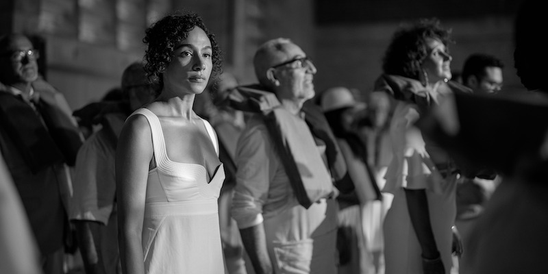 Black and white image of Aurora Perrineau as Riddy in 'KAOS'