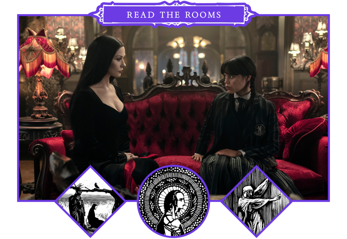 Catherine Zeta-Jones as Morticia Addams and Jenna Ortega as Wednesday Addams sitting on a red sofa in ‘Wednesday’ Season 2.
