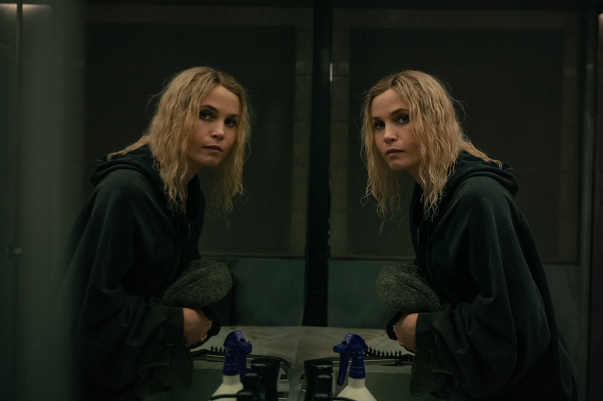 Gitte Witt faces her reflection in the mirror with wavy wet hair.