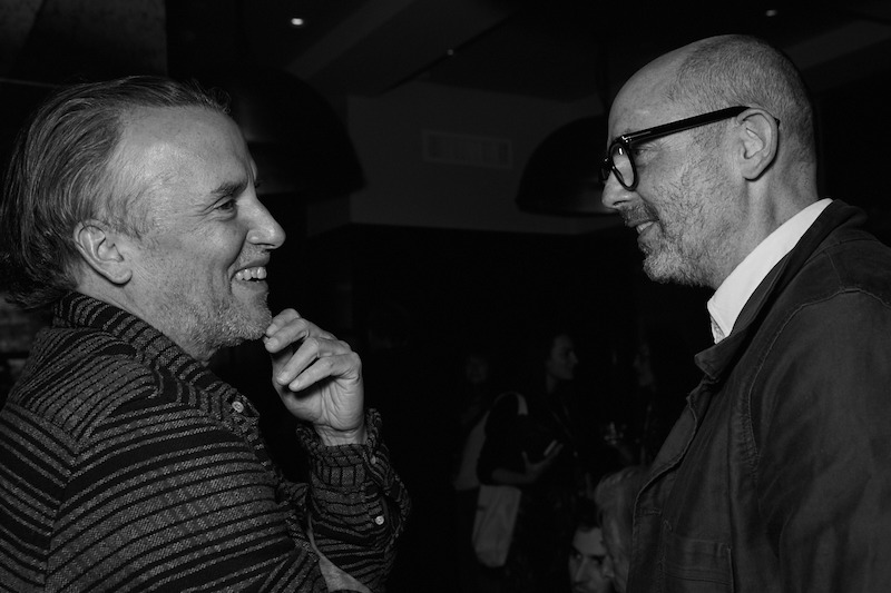  Richard Linklater and Edward Berger stand apart while talking.