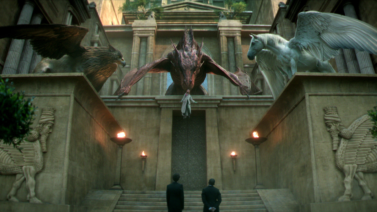 A dragon stands on a city gate looking down at two people in ‘The Sandman’ Season 2