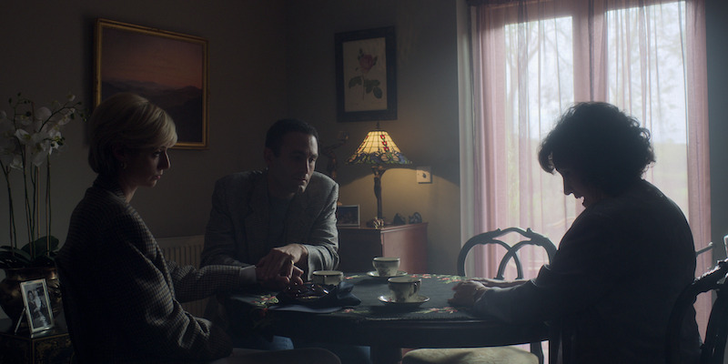 Brown houndstooth jacket and white pants