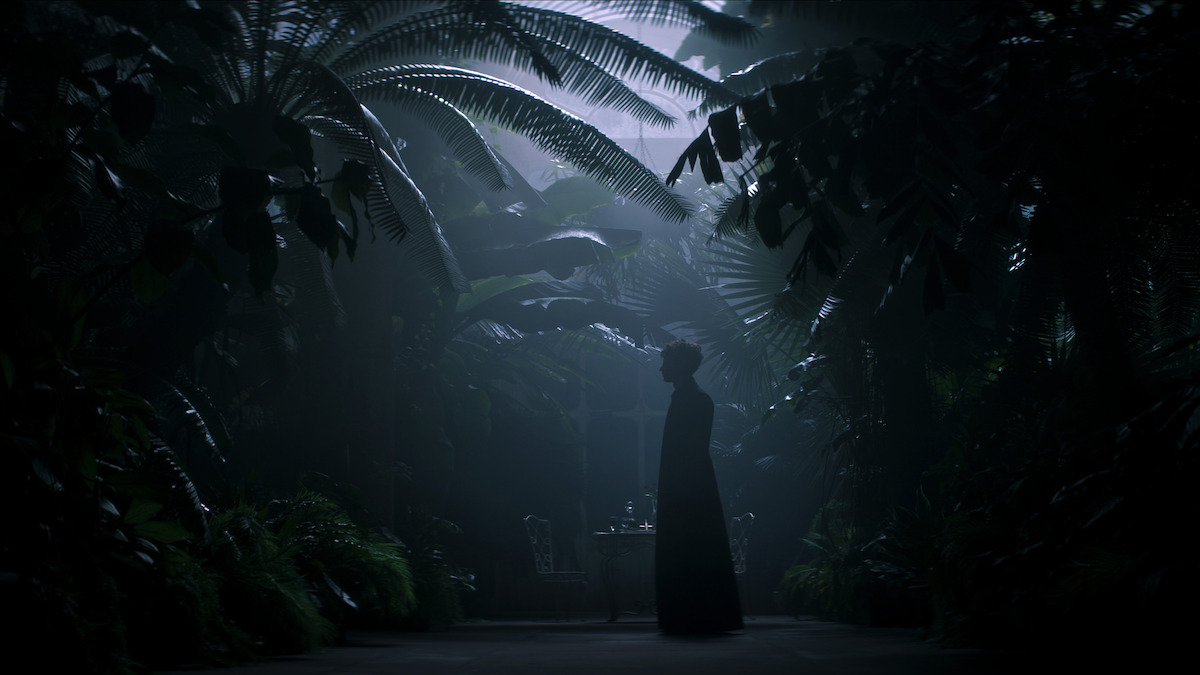 Tom Sturridge as Dream stands in a dark jungle in ‘The Sandman’ Season 2