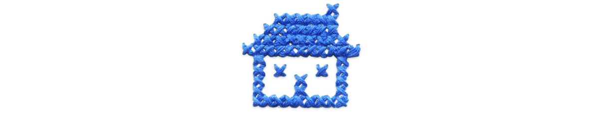 Blue cross stitched house.