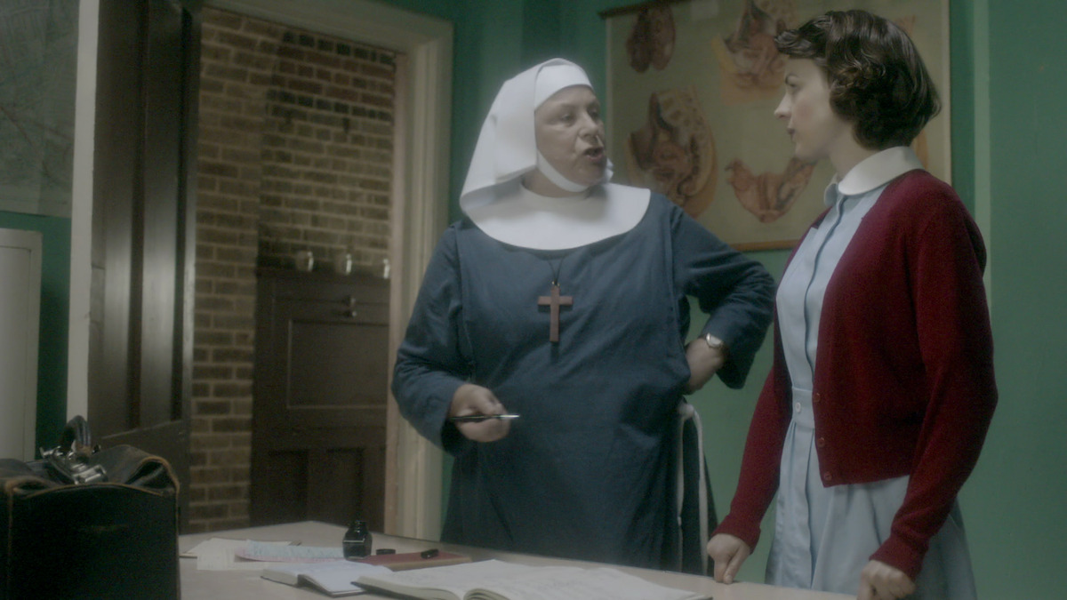 a nun and midwife in conversation. 