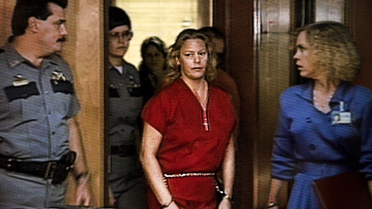 Aileen Wuornos, handcuffed, walking into court