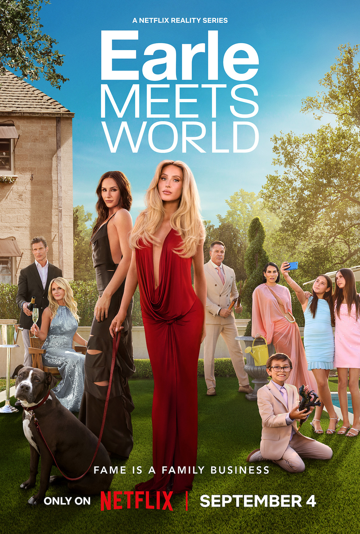 A glamorous family poses in an elegant garden with a large house, dressed in formal attire with a dog and party accessories, promoting the Netflix reality series Earle Meets World, premiering September 4.