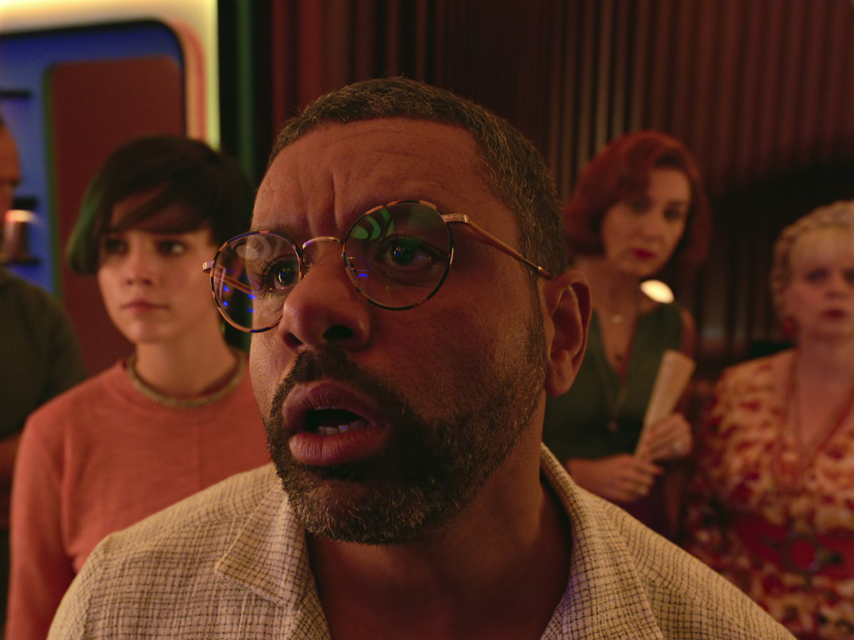 A close up photo of Victor in the film Bigbug