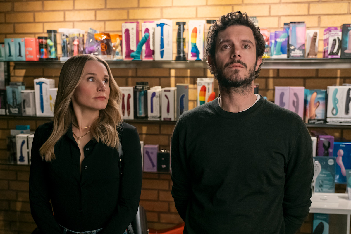 Joanne (Kristen Bell) and Noah (Adam Brody) stand in a sex store with reverent expressions.