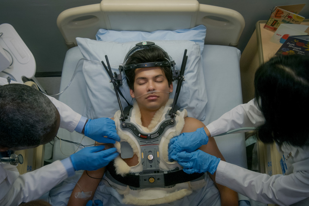 Miguel lies in a coma on a hospital bed