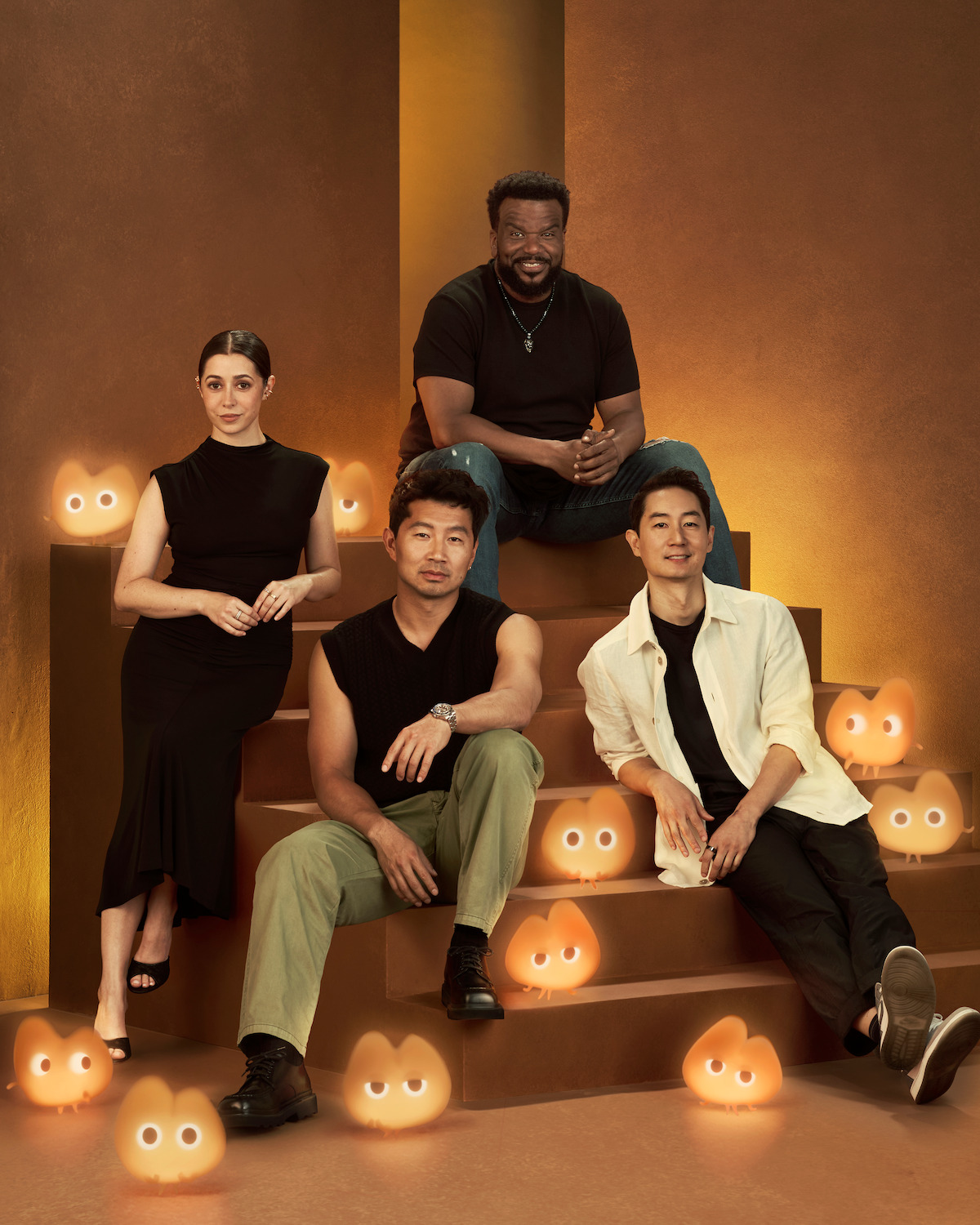 Cristin Milioti, Simu Liu, Craig Robinson, and Alex Woo sit on a staircase with sandlings.