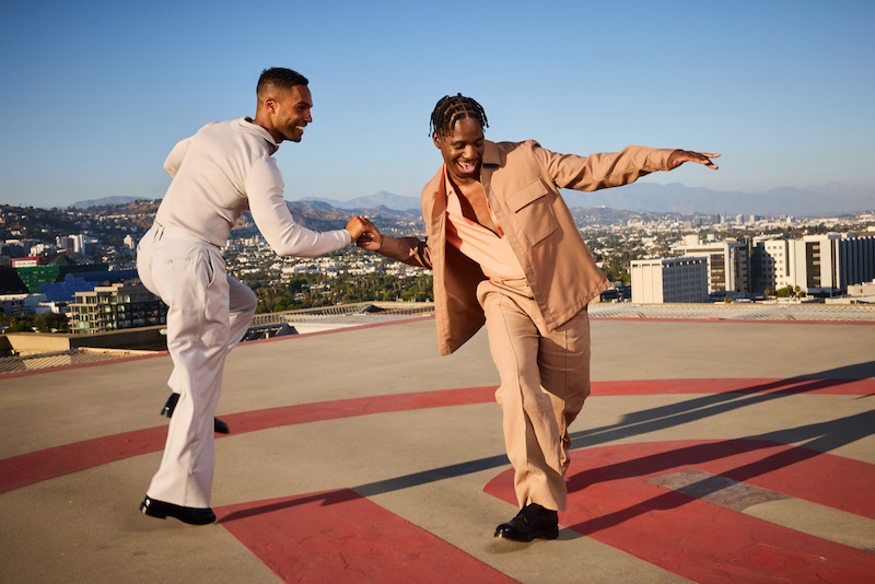 Lucien Laviscount and Samuel Arnold pose on a rooftop in Los Angeles. 