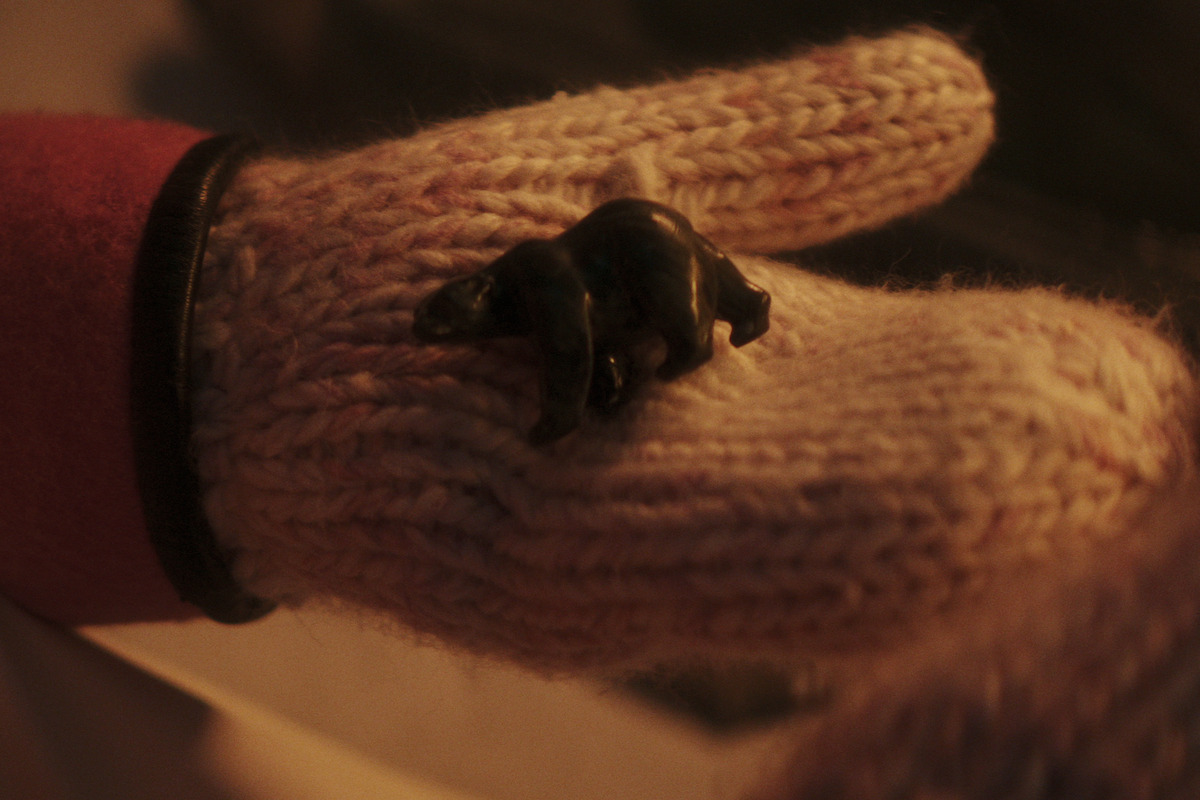 Niko holding a polar bear figurine.