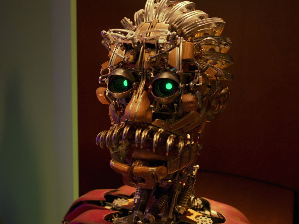A close up image of Einstein, the robot, from the film Bigbug