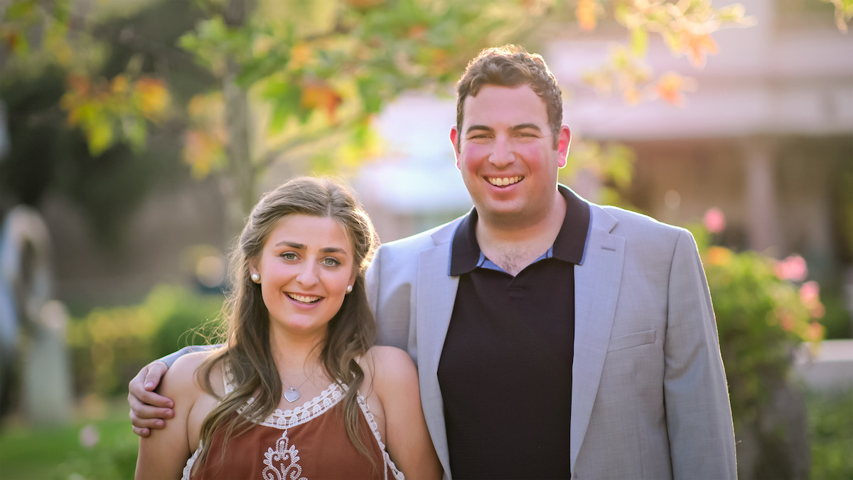 New couple embracing outside on a sunny day in Love on the Spectrum Season 3.