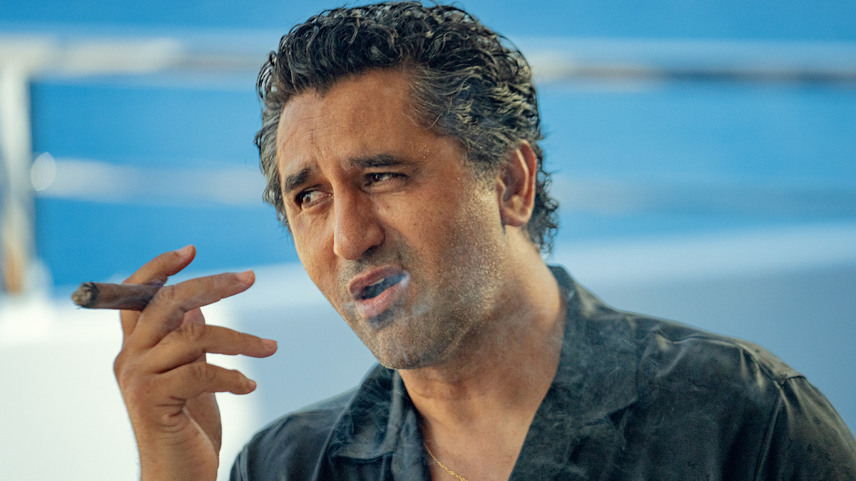 Cliff Curtis as Poseidon smokes a cigar in Season 1 of ‘Kaos’