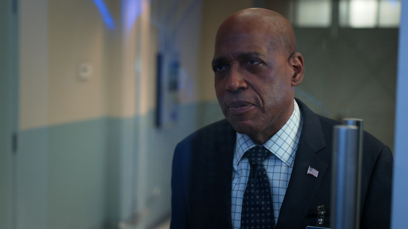 A man standing in a hallway