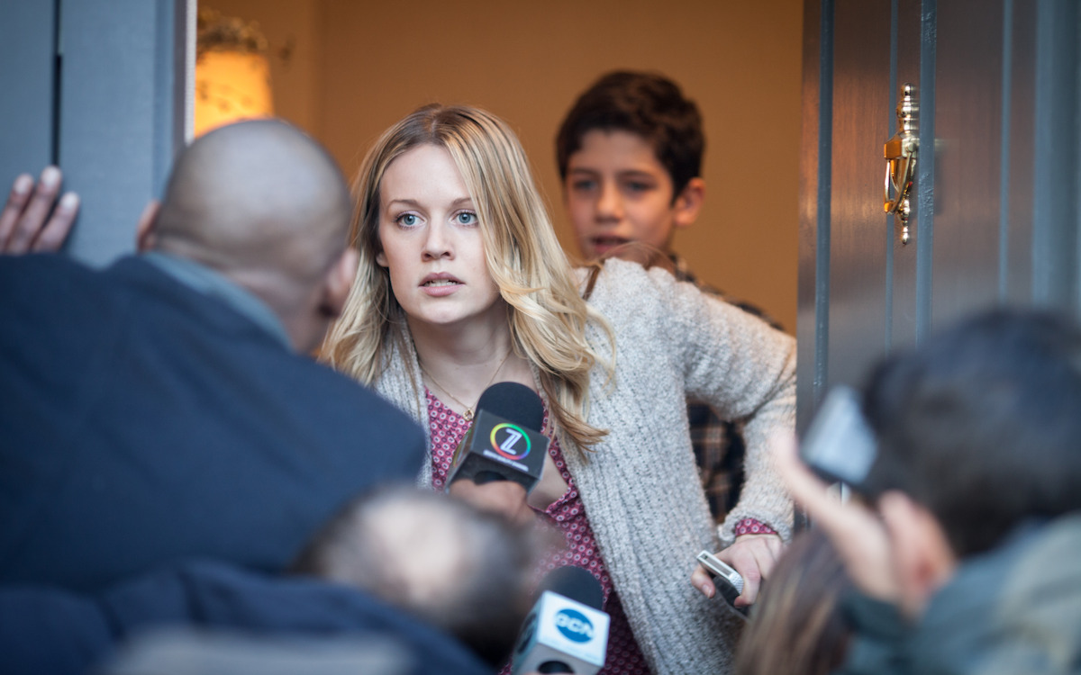 Cara Theobold as Alice Durand and Patrick McAuley as Flynn Durand fend off reporters in ‘Absentia.’
