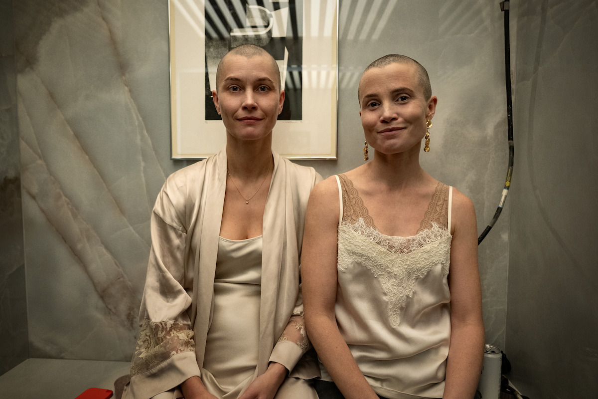 Actors Lisa Loven Kongsli and Gitte Witte sit side by side for BTS portrait.