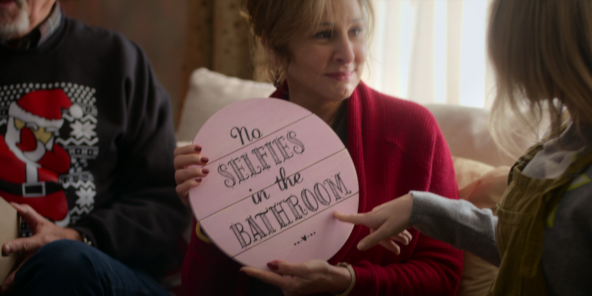 A sign in a suburban home reads