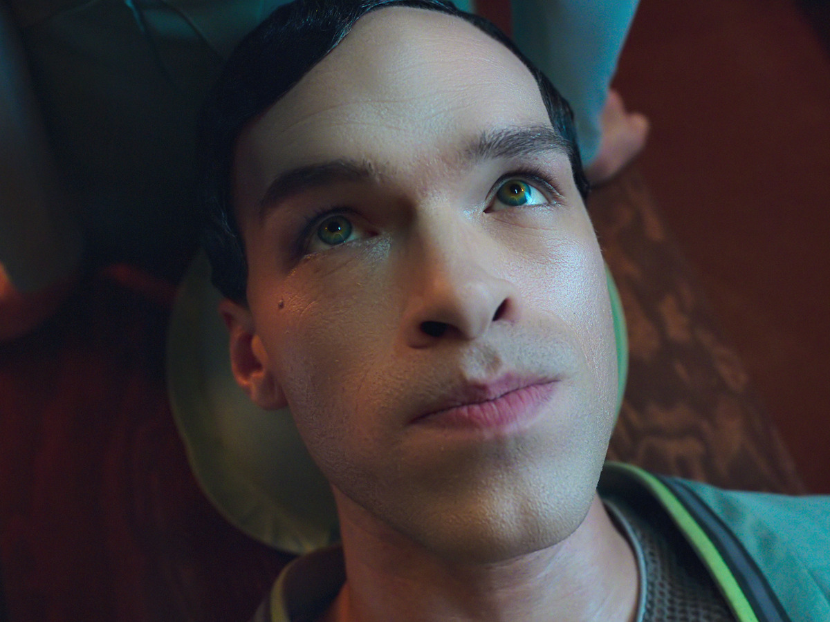A close up of Greg from the film Bigbug 