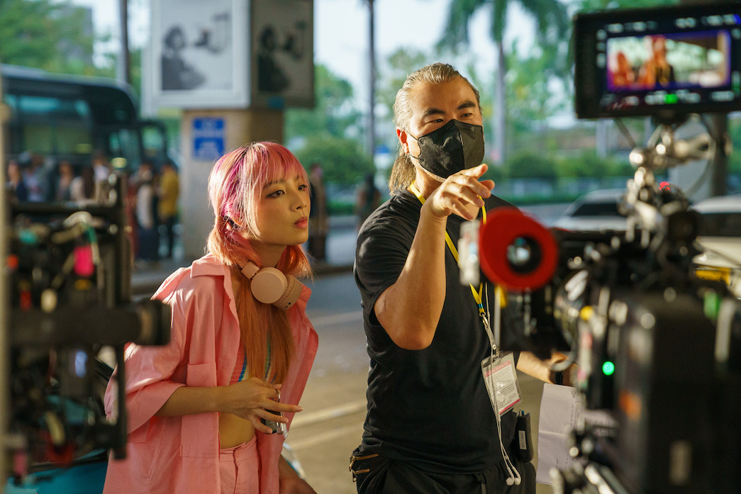 Director Steven Tsuchida and actor Quinn Trúc Trần discuss a scene.