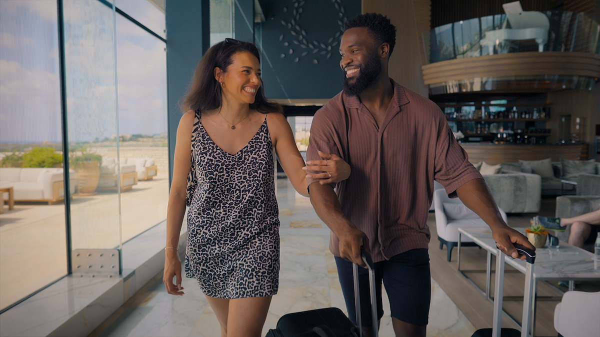 Javen and Katisha smiling as they walk side by side.