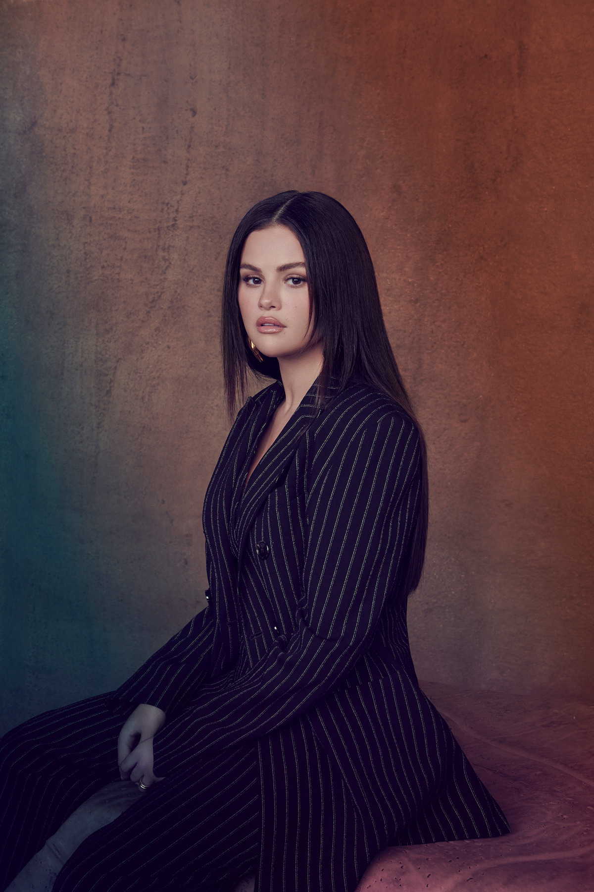 Selena Gomez wears a pinstripe suit.