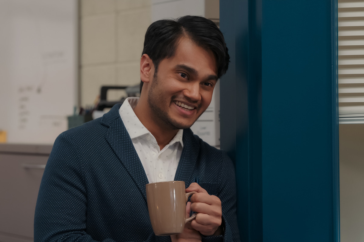 Moheb Jindran as Nikhil smiles at school in ‘My Life with the Walter Boys’ Season 1.