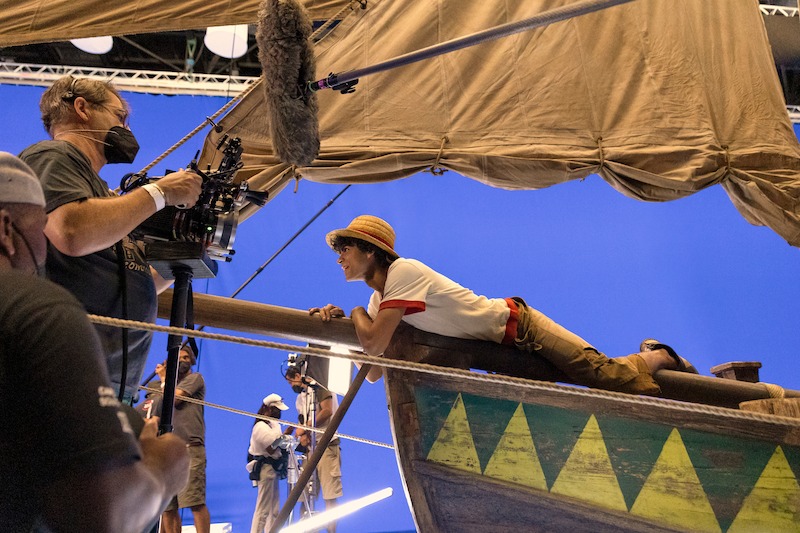 Iñaki Godoy as Monkey D. Luffy lays on a pirate ship on set of Season 1 of 'One Piece.'