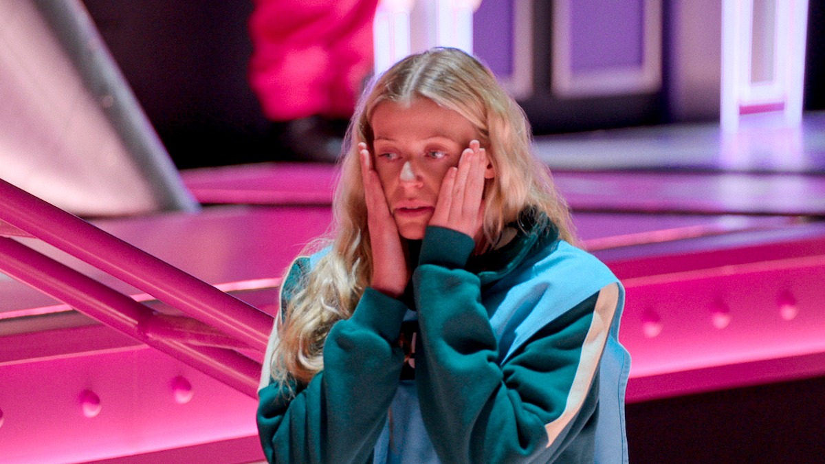 Player 451 holds hands to face.