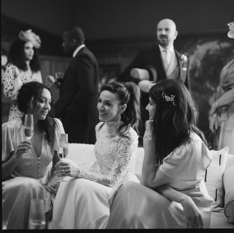 Black-and-white image of Michelle Keegan as Michelle Stern wearing a wedding dress behind the scenes in Season 1 of 'Fool Me Once'