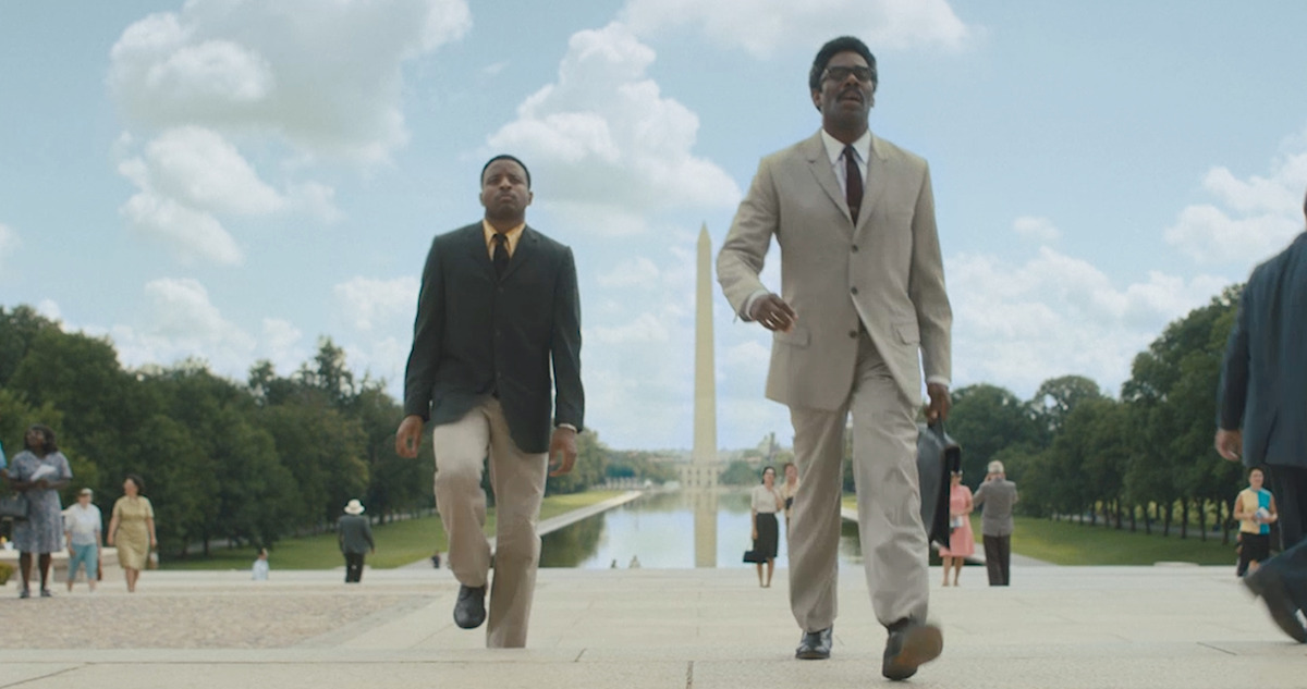 Colman Domingo (right) walks in front of the Washington Monument in a still from 'Rustin.'