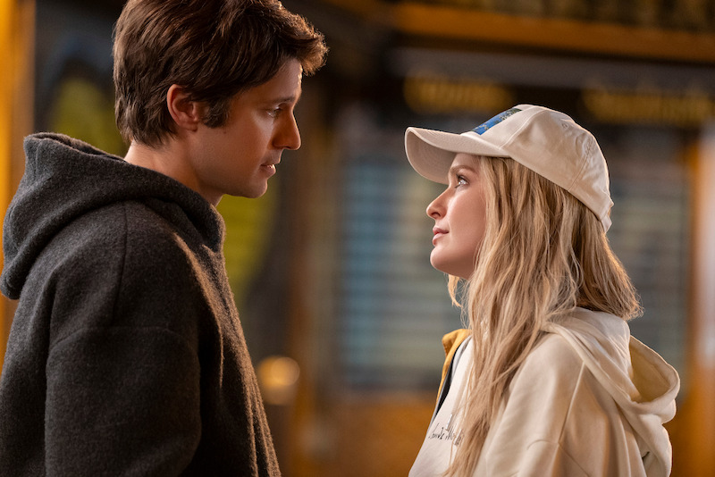 Lucas Bravo as Gabriel and Camille Razat as Camille stand face to face in Season 4 of 'Emily in Paris'