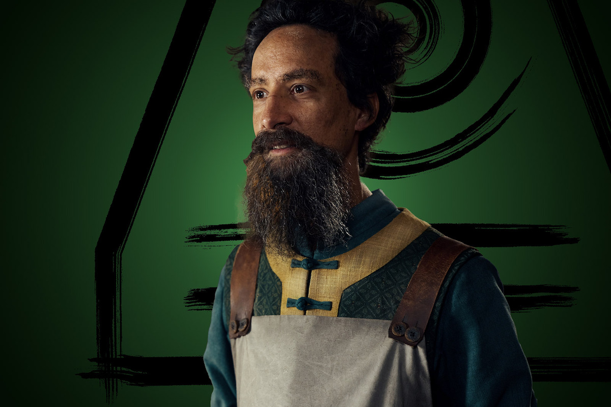 Danny Pudi as The Mechanist smiles in Season 1 of ‘Avatar: The Last Airbender’