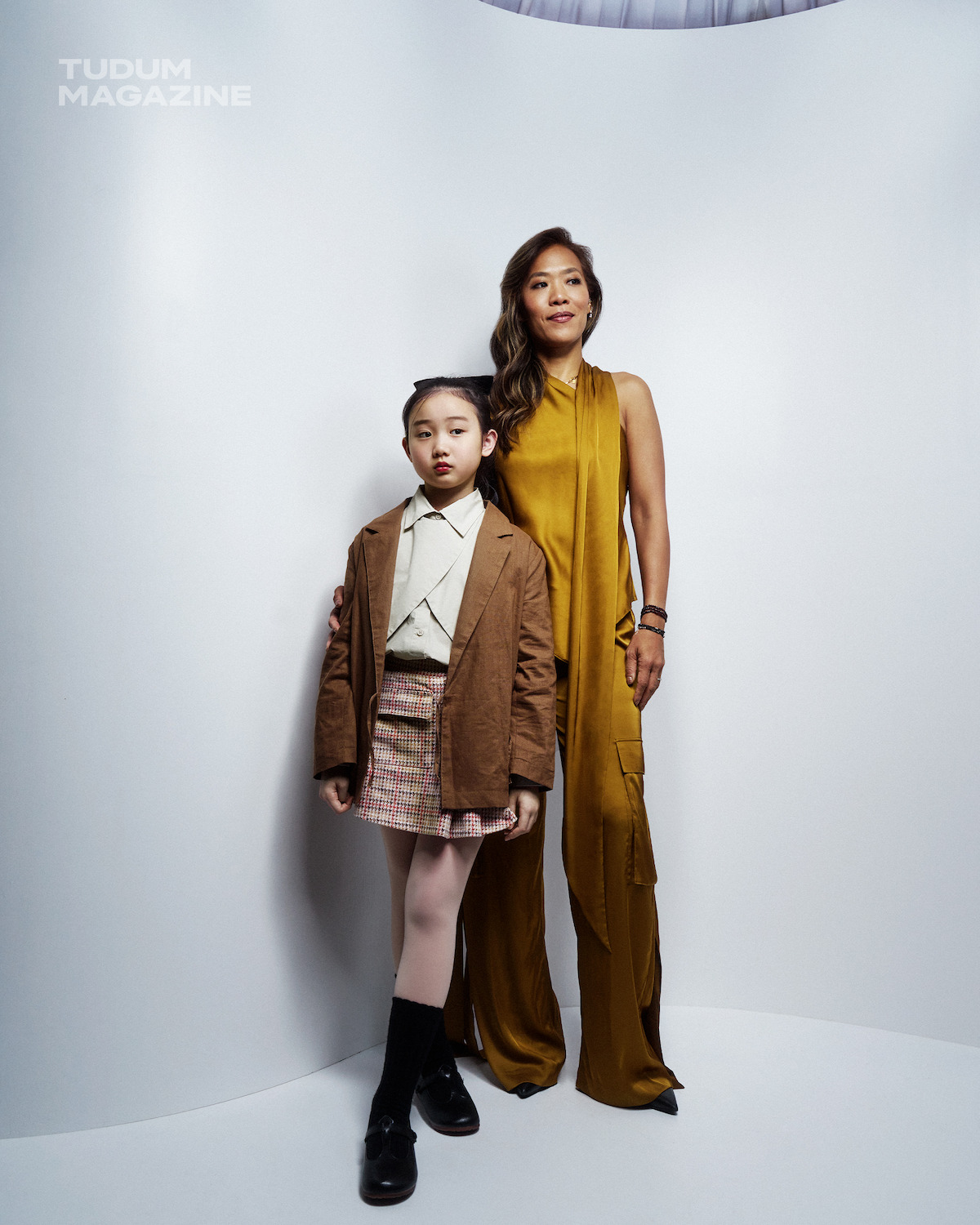 Nina Ye and Shih-Ching Tsou stand against a white backdrop.