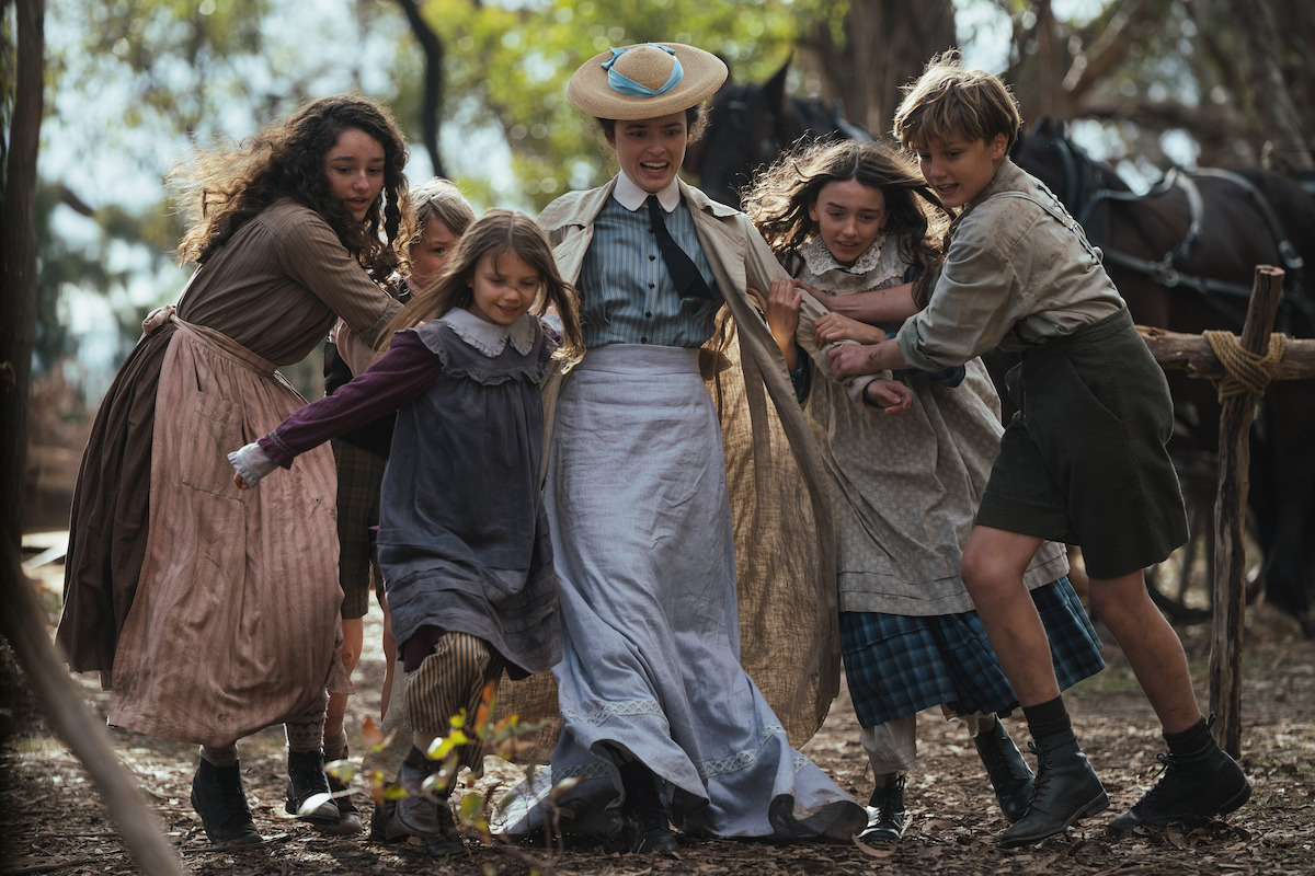Philippa Northeast as Sybylla Melvyn surrounded by a group of children in an image from ‘My Brilliant Career’