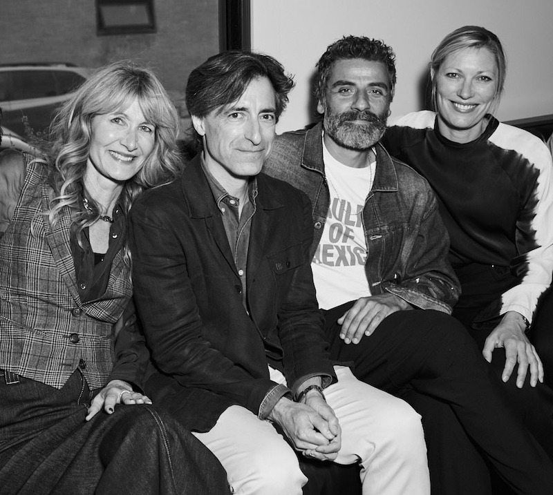 Laura Dern, Noah Baumbach, Oscar Isaac, and Elvira Lind sit next to each other while smiling to the camera.