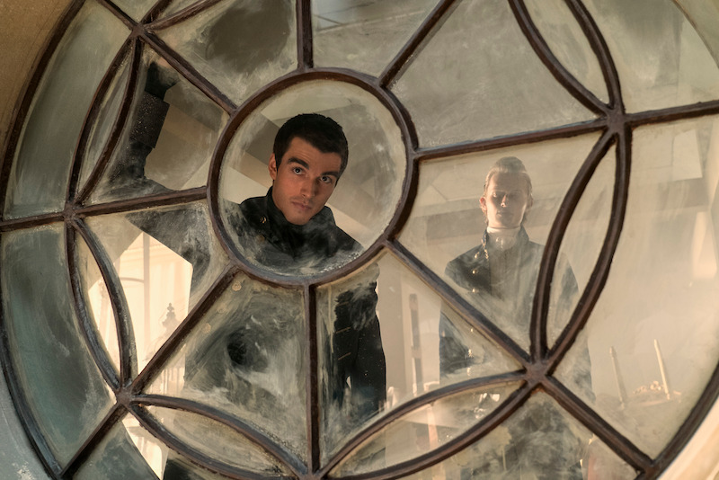 Corey Mylchreest and Freddie Dennis as young King George and Reynolds.