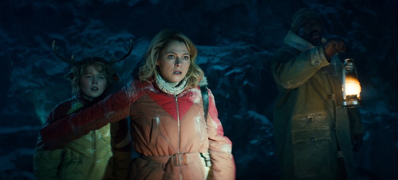 Christian Convery as Gus, Amy Seimetz as Birdie, Nonso Anozie as Jepperd explore a dark location in Season 3 of 'Sweet Tooth'