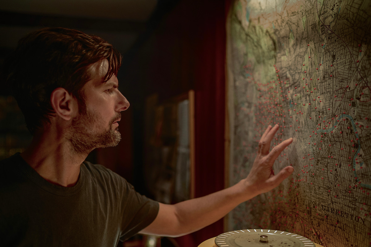 The Whisper Man. Adam Scott as Tom Kennedy in The Whisper Man. Cr. David Lee/Netflix © 2026