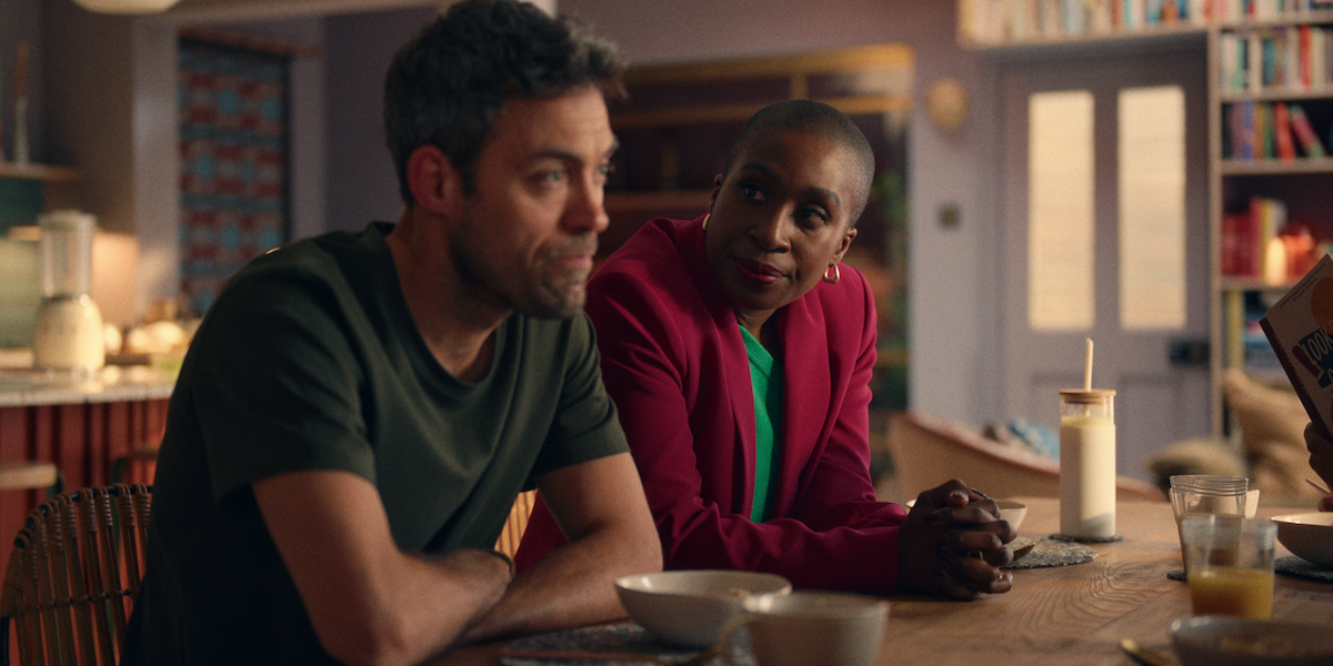 Vivienne Acheampong as Viv sits at a table with Alex Hassell as Rick in Season 1 of ‘Everything Now.’