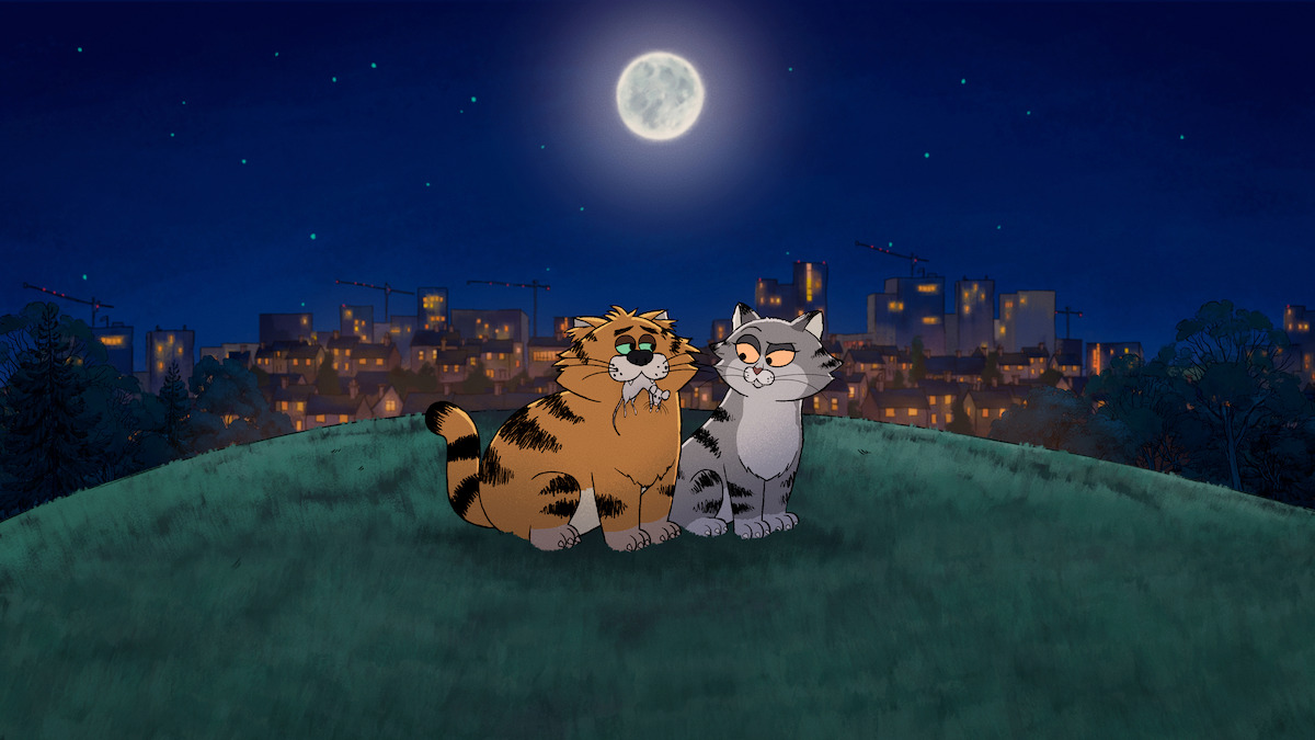 Two animated cats sit together on a grassy hill under a full moon at night, with a city skyline and lit buildings in the background.