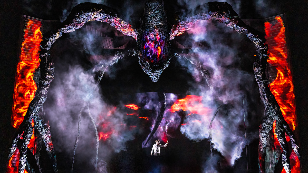 A massive mindflayer creature and Louis McCartney as Henry Creel on stage in 'Stranger Things: First Shadow' on Broadway.