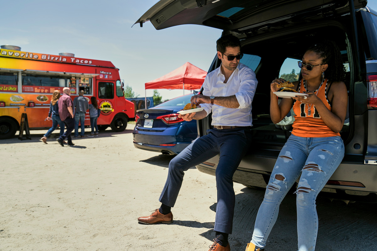 Mickey Haller (Manuel Garcia-Rulfo) introduces his driver Izzy Letts (Jazz Raycole) to birria tacos.