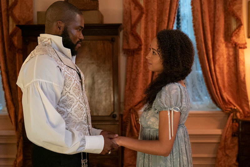 Imhangbe as Will Mondrich and Emma Naomi as Alice Mondrich hold hands with each other in season 3 of 'Bridgerton'