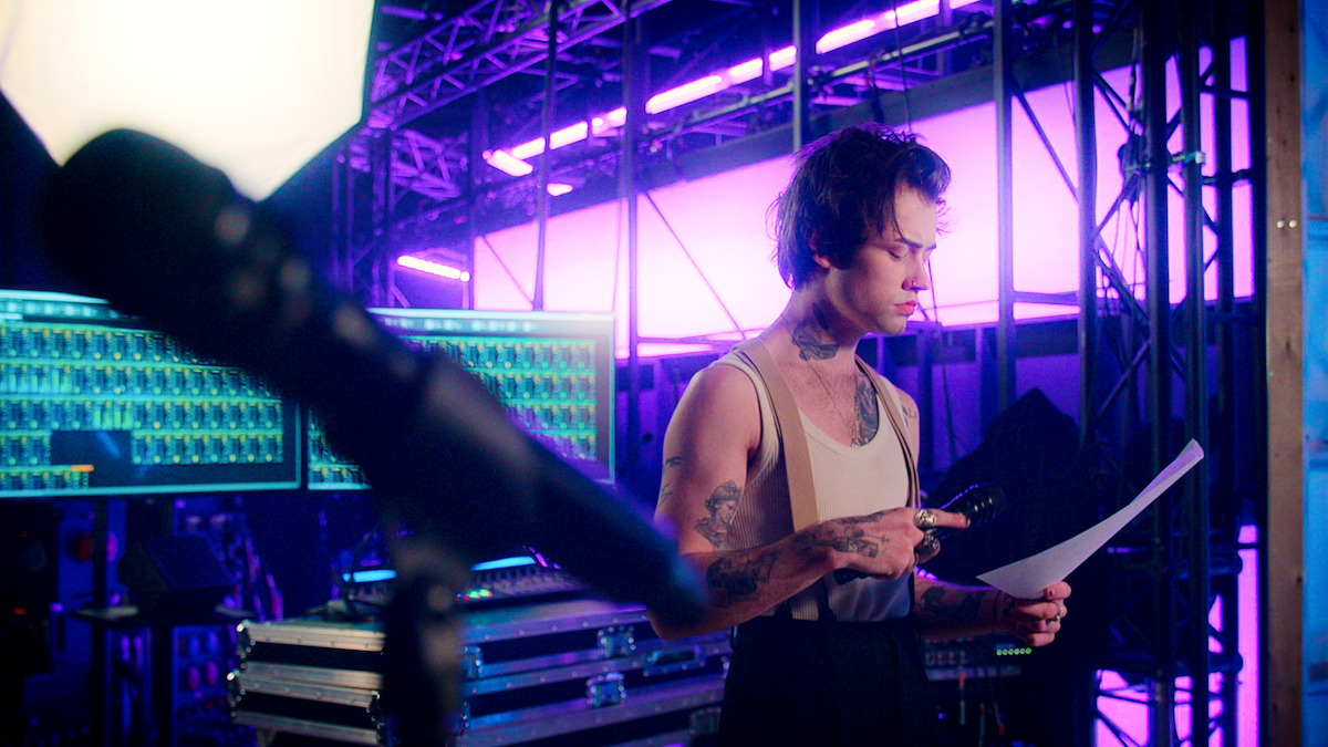 Conor Smith studies music before a performance.