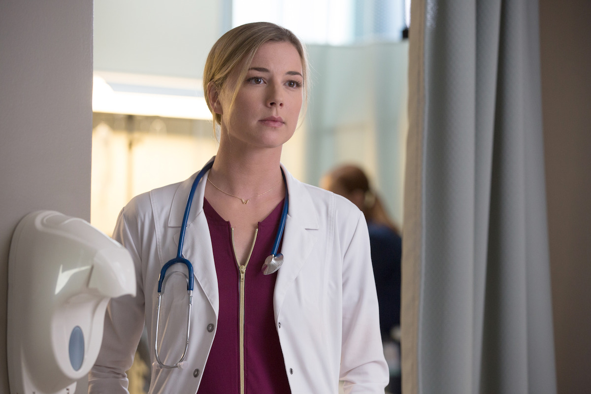 Emily VanCamp as Nic Nevin wears a doctor’s coat and a stethoscope around her neck in ‘The Resident.’