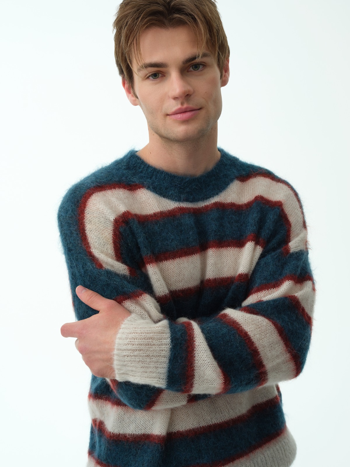 Close up of Noah LaLonde wearing a blue and white striped sweater for ‘My Life with the Walter Boys’